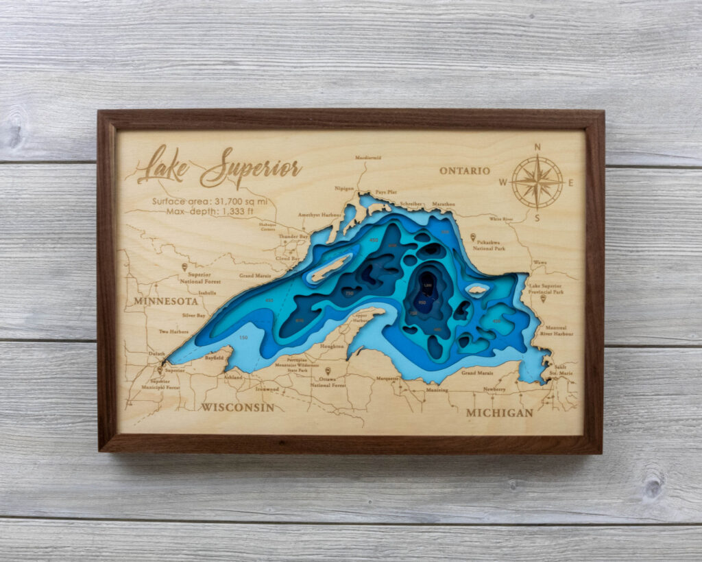 Multilayered map of Lake Superior with walnut frame